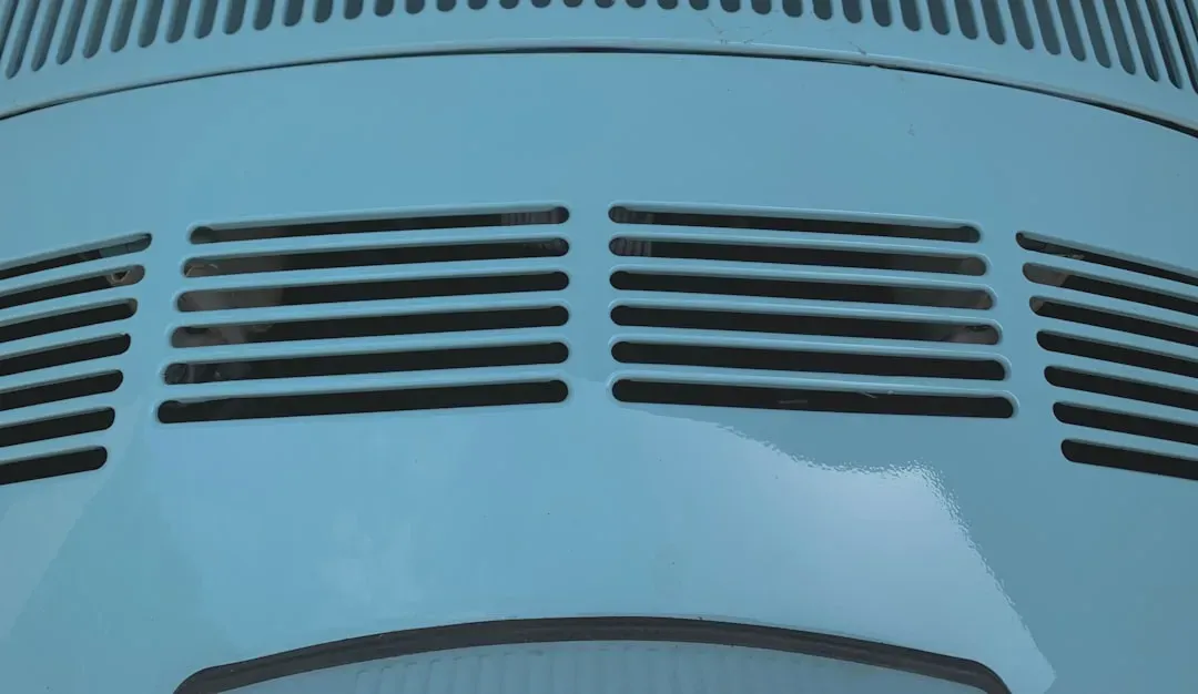 Close-up of HVAC air filter held to light showing layered material texture and dust particles, illustrating MERV Rating Guide